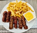 Meatballs meat french fries mutard plate