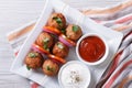 Meatballs on skewers with vegetables and sauce top view Royalty Free Stock Photo