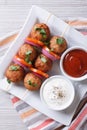 Meatballs on skewers with vegetables top view vertical Royalty Free Stock Photo