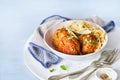Meatballs with spaghetti, tomato sauce, parmesan cheese crumbles, healthy dinner, lunch on light blue background. Close-up. select Royalty Free Stock Photo