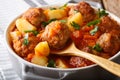 Meatballs stewed with vegetables in a tomato sauce close-up in a Royalty Free Stock Photo