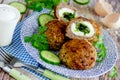 Meatballs stuffed with boiled eggs and green herbs butter