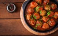 Meatballs in sweet and sour tomato sauce