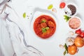 Meatballs in tomato sauce with ingredients in bakground. Royalty Free Stock Photo