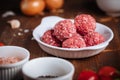 Meatballs in tomato sauce with ingredients in bakground. Royalty Free Stock Photo