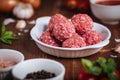 Meatballs in tomato sauce with ingredients in bakground. Royalty Free Stock Photo