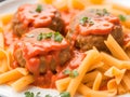 meatballs in tomato sauce and pasta on a plate