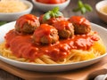 meatballs in tomato sauce and pasta on a plate