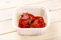 Meatballs in tomato sauce. In a plastic container. Food to go. On a light background Royalty Free Stock Photo