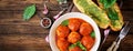 Meatballs in tomato sauce and toast with basil pesto. Dinner. Ta Royalty Free Stock Photo