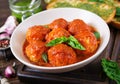 Meatballs in tomato sauce and toast with basil pesto. Dinner. Royalty Free Stock Photo