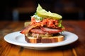 meatloaf sandwich on rustic bread with lettuce