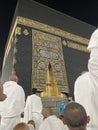 Male worshipers pray at the door of the Kaaba in the Grand Mosque of Mecca