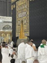 Male worshipers pray at the door of the Kaaba