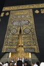 MECCA, SAUDI ARABIA - MAY 01 2018: The golden doors of the Holy Kaaba closeup, covered with Kiswah. Massive lock on the doors. Ent