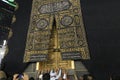 MECCA, SAUDI ARABIA - MAY 01 2018: The golden doors of the Holy Kaaba closeup, covered with Kiswah. Massive lock on the doors. Ent