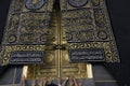 MECCA, SAUDI ARABIA - MAY 01 2018: The golden doors of the Holy Kaaba closeup, covered with Kiswah. Massive lock on the doors. Ent