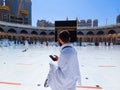 The Holy Kaaba Mecca - Pilgrims return to Masjid al-Haram in Makka for limited umrah as  coronavirus restrictions - face mask wear Royalty Free Stock Photo