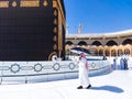 The Holy Kaaba Mecca - Pilgrims return to Masjid al-Haram in Makka for limited umrah as  coronavirus restrictions - face mask wear Royalty Free Stock Photo