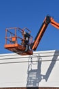 Mechancial lift bucket throws it`s shadow Royalty Free Stock Photo