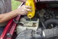 A Mechanic Adding Coolant To A Older Truck