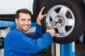 Mechanic adjusting the tire wheel