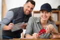 Mechanic and apprentice soldering cooper pipes