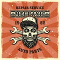 Mechanic bearded skull in cap and wrenches emblem