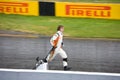 Mechanic carrying F1 nose at Montreal Grand prix Royalty Free Stock Photo