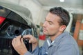 Mechanic changing a bulb Royalty Free Stock Photo