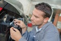 Mechanic changing a bulb Royalty Free Stock Photo