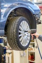 Mechanic changing car wheel. Royalty Free Stock Photo