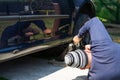 Mechanic changing wheel on car with manual wrench. Mechanic replacing tires in Bucharest, Romania, 2021 Royalty Free Stock Photo