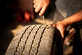 Mechanic changing wheel on car with pneumatic wrench, Royalty Free Stock Photo