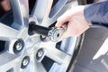 Mechanic changing wheel on car Royalty Free Stock Photo