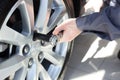 Mechanic changing wheel on car Royalty Free Stock Photo