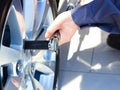 Mechanic changing wheel on car Royalty Free Stock Photo