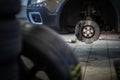 Mechanic changing a wheel of a modern car Royalty Free Stock Photo