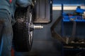 Mechanic changing a wheel of a modern car Royalty Free Stock Photo