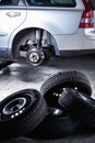 Mechanic changing a wheel of a modern car Royalty Free Stock Photo