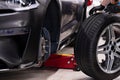 Mechanic changing wheel and tire. Car service Royalty Free Stock Photo