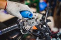 Mechanic Check and Add Brake Fluid on Motorcycle brake reservoir Royalty Free Stock Photo
