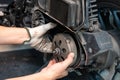 Mechanic check Auto Transmission system of big scooter Motorcycles in garage. maintenance, repair motorcycle concept in garage . Royalty Free Stock Photo