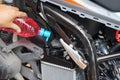 Mechanic Check water in Car radiator and Add water to motorcycle or scooter radiator in the garage ,The radiator is the main compo