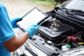 Using technology to manage car engine. Car service and maintenance. Royalty Free Stock Photo