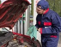 Mechanic Checking Engine Royalty Free Stock Photo