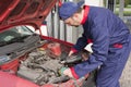 Mechanic Checking Engine Royalty Free Stock Photo