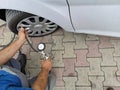 Mechanic checks tire pressure