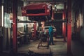 Mechanic in classic car restoration workshop Royalty Free Stock Photo