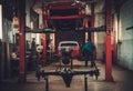 Mechanic in classic car restoration workshop Royalty Free Stock Photo